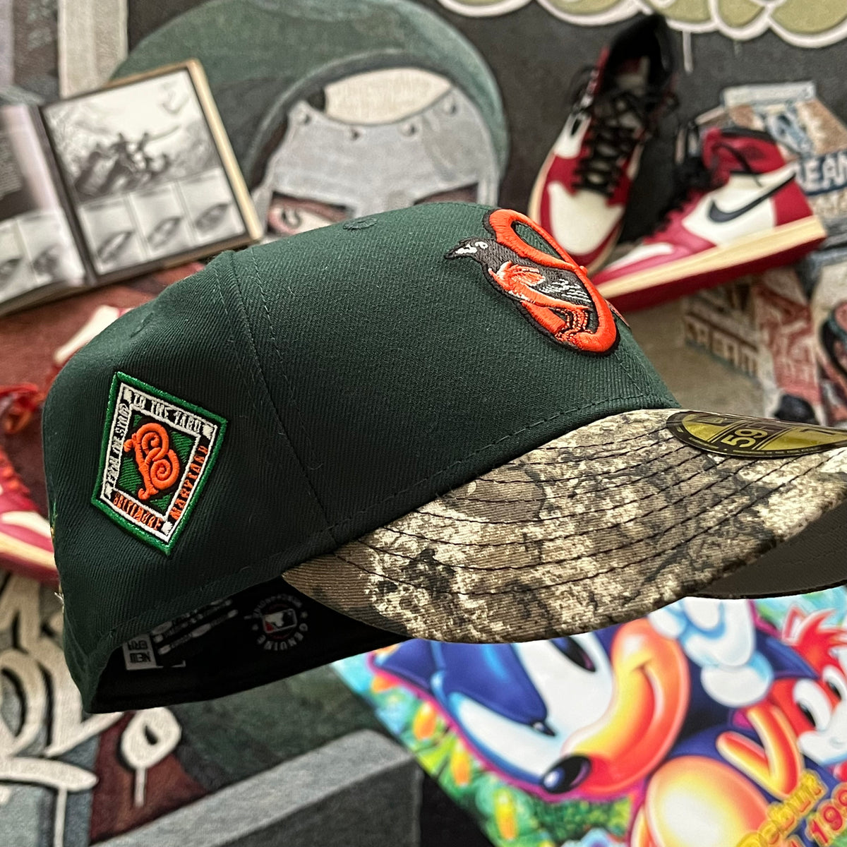 FOREST GREEN TWO-TONE CAMO BRIM (GREY UV) BALTIMORE ORIOLES 2026 CITY SIDE PATCH FITTED HAT